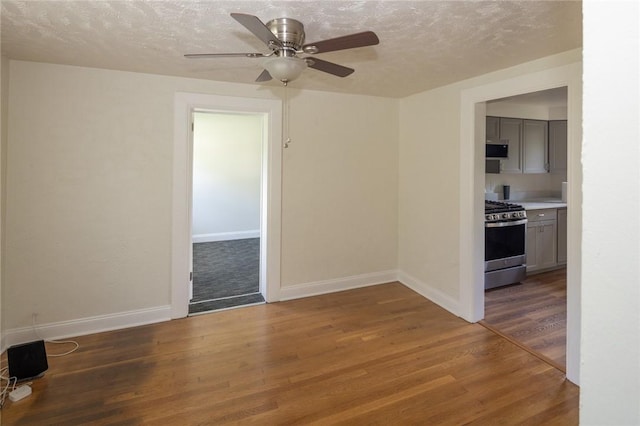 111 E Manilla, Green Tree, PA 15220 - empty room featuring a textured ceiling, a ceiling fan, and wood finished floors