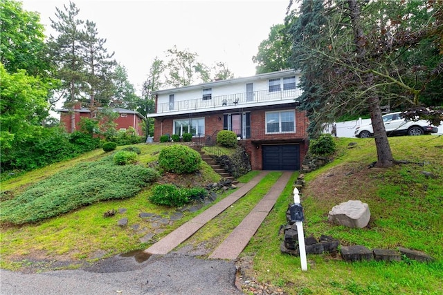 5401 Perrysville Rd, Ross Twp, PA 15229 - view of front facade featuring driveway, stairway, an attached garage, brick siding, and a balcony