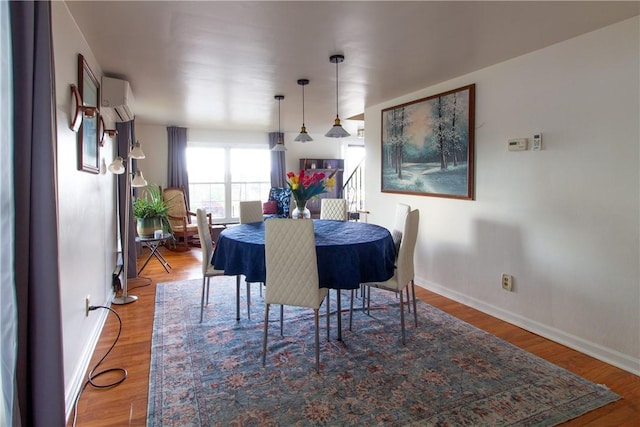 5401 Perrysville Rd, Ross Twp, PA 15229 - dining space with a wall unit AC and wood finished floors