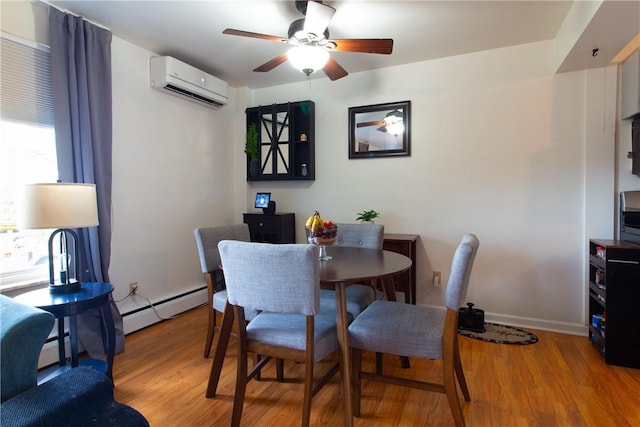 5401 Perrysville Rd, Ross Twp, PA 15229 - dining space with a wall unit AC, light wood-style floors, a ceiling fan, and a baseboard heating unit