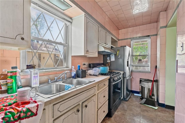1503 Beechview Ave, Beechview, PA 15216 - kitchen with appliances with stainless steel finishes, under cabinet range hood, light countertops, and light tile patterned floors