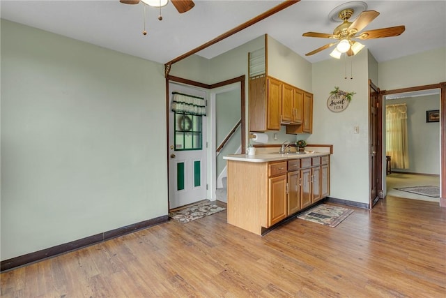 248 Shaffer Rd, North Sewickley Twp, PA 15010 - kitchen with ceiling fan, light countertops, lofted ceiling, light wood finished floors, and brown cabinetry