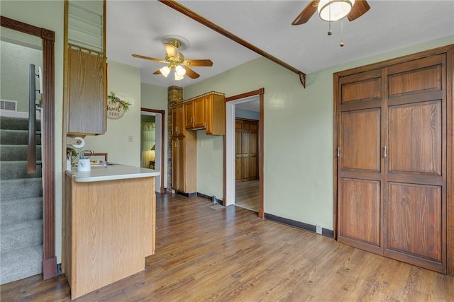 248 Shaffer Rd, North Sewickley Twp, PA 15010 - kitchen featuring a ceiling fan, wood finished floors, and brown cabinets