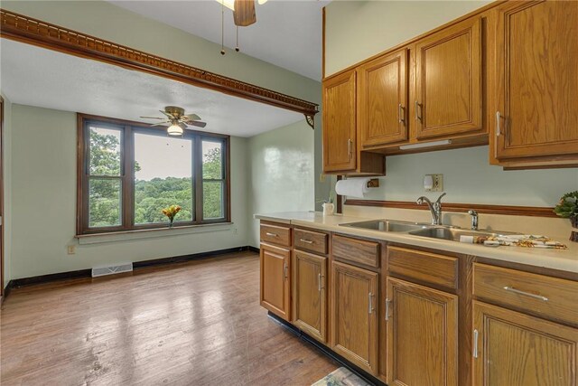 248 Shaffer Rd, North Sewickley Twp, PA 15010 - kitchen with ceiling fan, brown cabinetry, light countertops, and light wood finished floors