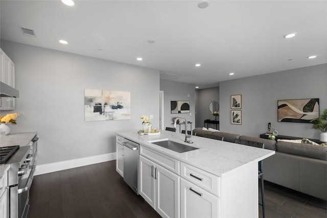 350 Oliver Ave Unit 1301/1401, Downtown Pgh, PA 15222 - kitchen with open floor plan, appliances with stainless steel finishes, recessed lighting, light stone countertops, and dark wood-style flooring