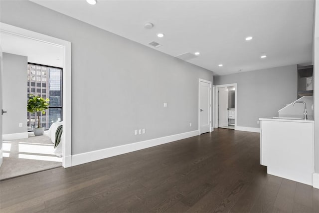 350 Oliver Ave Unit 1301/1401, Downtown Pgh, PA 15222 - unfurnished living room with dark wood-type flooring and recessed lighting