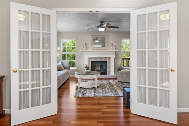 706 Williamsburg Ct, Cranberry Twp, PA 16066 - living area with a ceiling fan, a fireplace, wood finished floors, and a textured ceiling