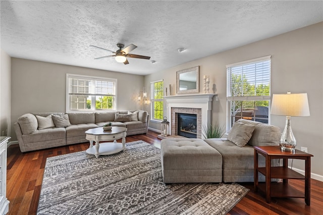 706 Williamsburg Ct, Cranberry Twp, PA 16066 - living room featuring a ceiling fan, wood finished floors, a brick fireplace, and a textured ceiling