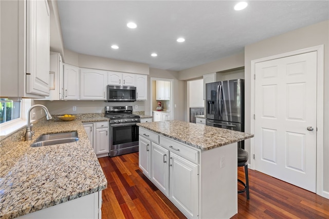 706 Williamsburg Ct, Cranberry Twp, PA 16066 - kitchen with appliances with stainless steel finishes, light stone countertops, a center island, recessed lighting, and white cabinetry