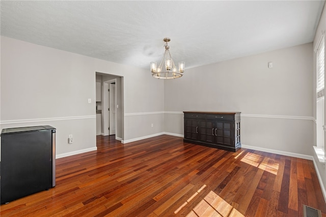 706 Williamsburg Ct, Cranberry Twp, PA 16066 - empty room with a chandelier and wood finished floors