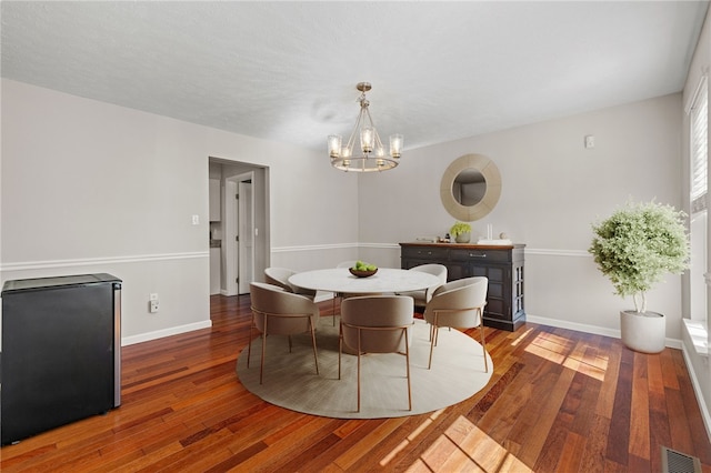 706 Williamsburg Ct, Cranberry Twp, PA 16066 - dining room featuring a chandelier and wood finished floors
