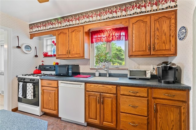 418 Sylvania Dr, Ross Twp, PA 15229 - kitchen featuring white appliances, wallpapered walls, brown cabinets, and dark countertops