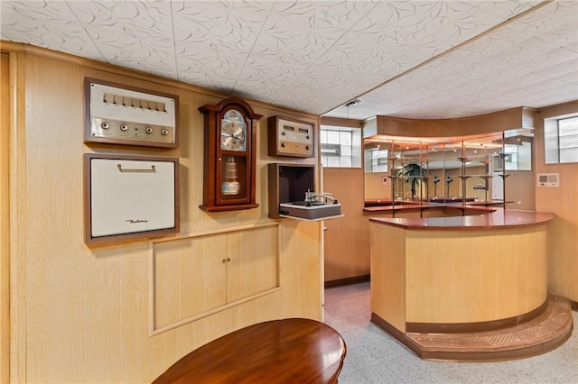 418 Sylvania Dr, Ross Twp, PA 15229 - indoor wet bar with plenty of natural light and speckle patterned floor