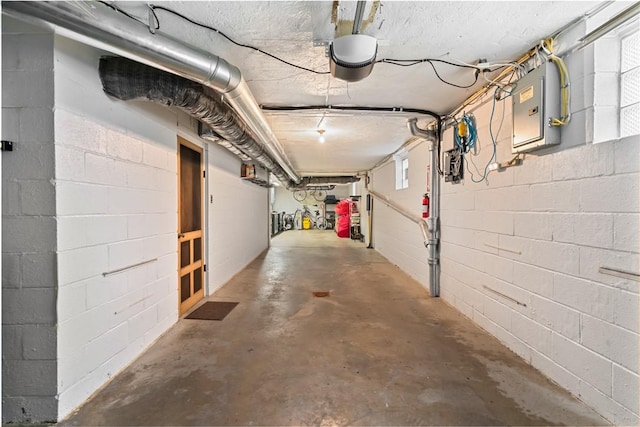 418 Sylvania Dr, Ross Twp, PA 15229 - basement featuring a garage, electric panel, and concrete block wall
