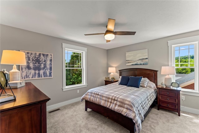106 Anderson Sta, Peters Twp, PA 15367 - bedroom featuring multiple windows, light colored carpet, and ceiling fan