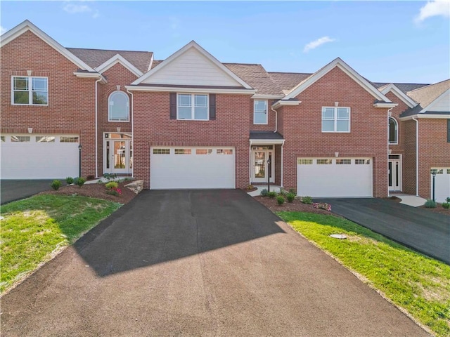 106 Anderson Sta, Peters Twp, PA 15367 - view of front of home featuring driveway, an attached garage, and brick siding