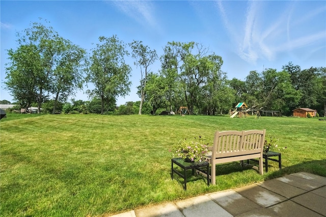 412 Colt Cir, Findlay Twp, PA 15026 - view of property's community with a playground, a yard, a storage unit, and view of wooded area