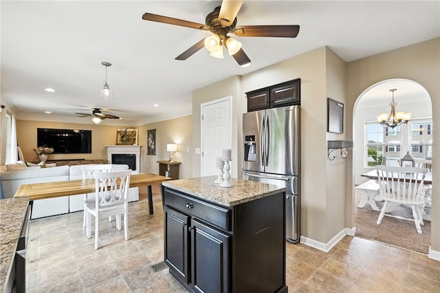 412 Colt Cir, Findlay Twp, PA 15026 - kitchen featuring stainless steel fridge with ice dispenser, a ceiling fan, a fireplace, a chandelier, and decorative light fixtures