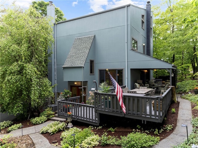 101 Jane Kirk Ct, Center Twp, PA 15001 - rear view of house featuring a chimney, a deck, and a shingled roof