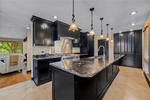 101 Jane Kirk Ct, Center Twp, PA 15001 - kitchen with dark cabinets, range, decorative backsplash, dark stone countertops, and recessed lighting