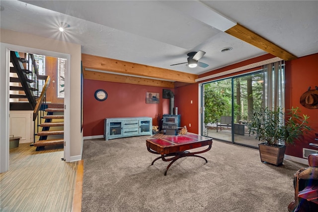 101 Jane Kirk Ct, Center Twp, PA 15001 - living area with a wood stove, beam ceiling, stairs, plenty of natural light, and ceiling fan
