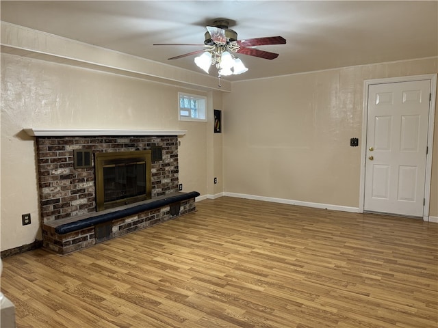 2350 Mount Vernon Ave, Murrysville, PA 15632 - unfurnished living room featuring a ceiling fan, wood finished floors, a brick fireplace, and ornamental molding