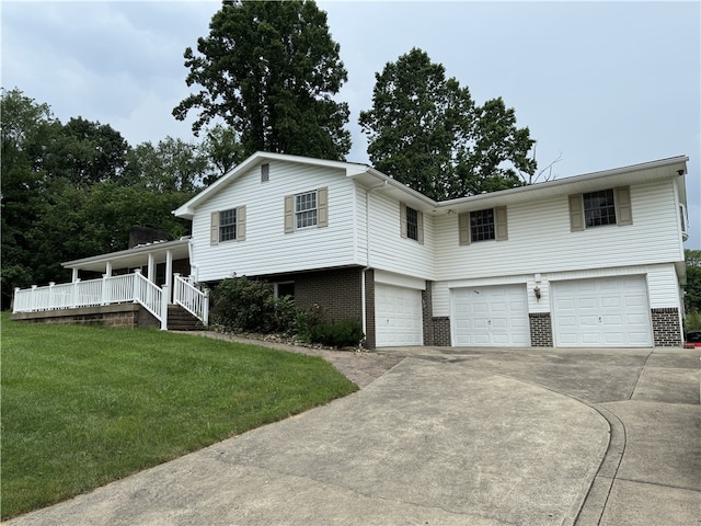 2350 Mount Vernon Ave, Murrysville, PA 15632 - split level home with an attached garage, brick siding, a front lawn, and concrete driveway