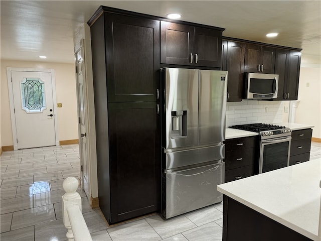 2350 Mount Vernon Ave, Murrysville, PA 15632 - kitchen with stainless steel appliances, light countertops, decorative backsplash, recessed lighting, and light tile patterned flooring