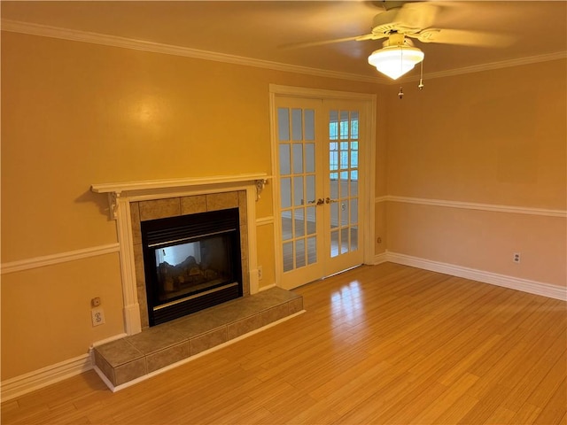 2350 Mount Vernon Ave, Murrysville, PA 15632 - unfurnished living room with wood finished floors, a fireplace, a ceiling fan, ornamental molding, and french doors