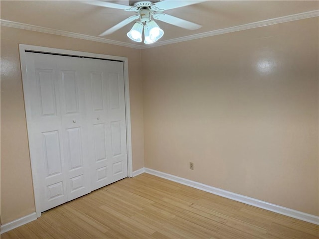 2350 Mount Vernon Ave, Murrysville, PA 15632 - unfurnished bedroom with light wood finished floors, ornamental molding, a closet, and ceiling fan