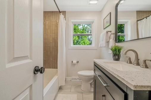 228 Kuehn Dr, Penn Twp, PA 15085 - bathroom featuring vanity, tile patterned flooring, and shower / bath combo with shower curtain