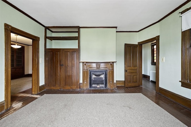 425 Concord Ave, City Of Greensburg, PA 15601 - unfurnished living room with radiator heating unit, dark wood finished floors, ornamental molding, and a fireplace with flush hearth
