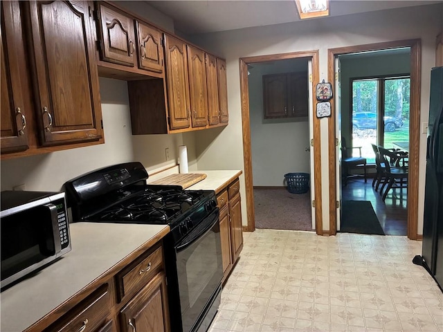 5569 E State St, Hermitage, PA 16148 - kitchen with black appliances, light countertops, and light floors