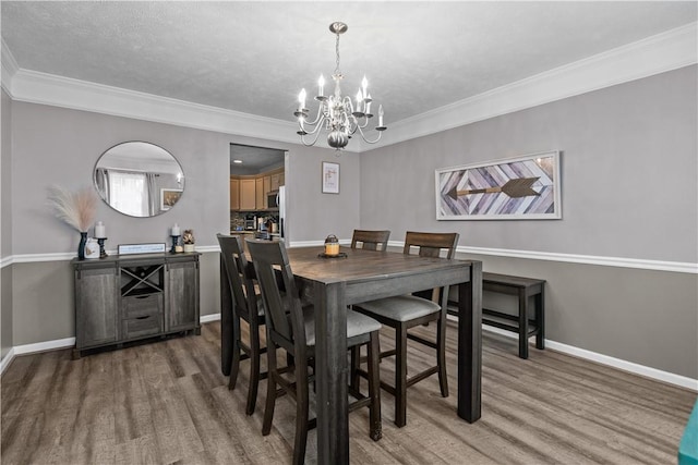 421 Colt Cir, Findlay Twp, PA 15026 - dining room with a chandelier, wood finished floors, and ornamental molding