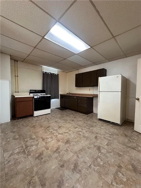 3027 Stayton St, Marshall Shadeland, PA 15212 - kitchen featuring white appliances, a paneled ceiling, dark brown cabinetry, and light countertops