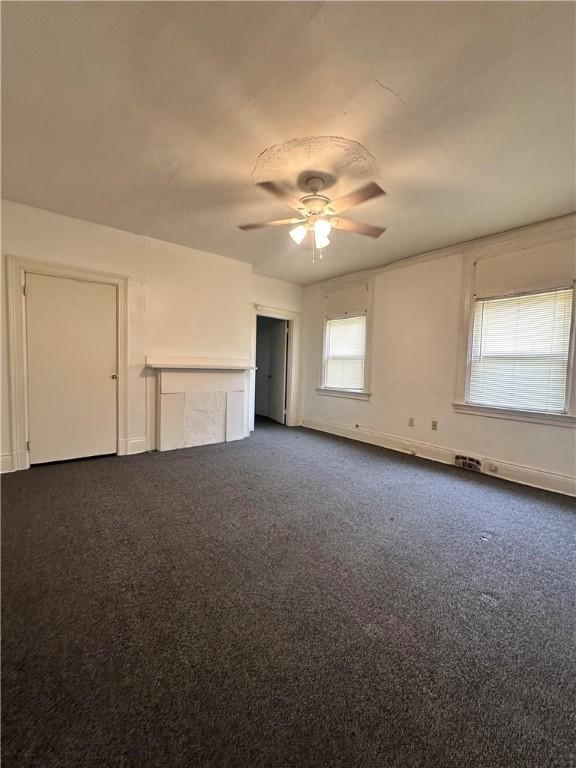 3027 Stayton St, Marshall Shadeland, PA 15212 - empty room featuring dark carpet and a ceiling fan