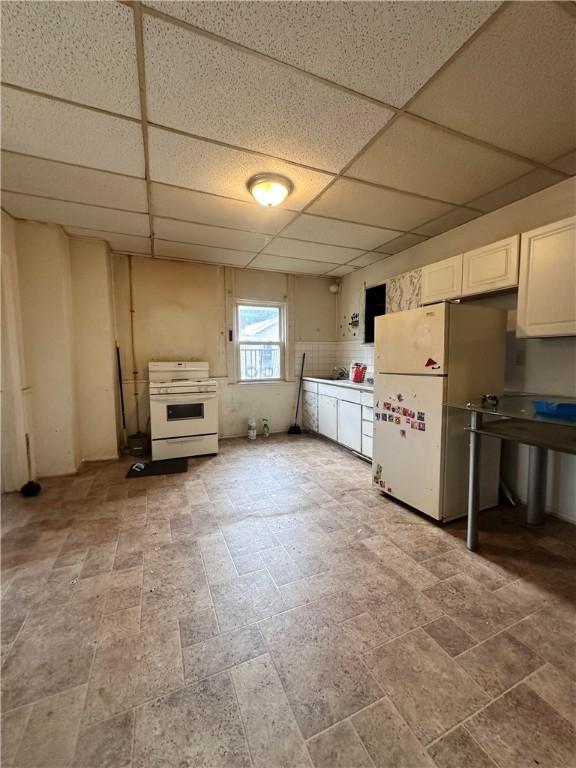 3027 Stayton St, Marshall Shadeland, PA 15212 - kitchen with white appliances, a paneled ceiling, white cabinetry, and light stone finish flooring