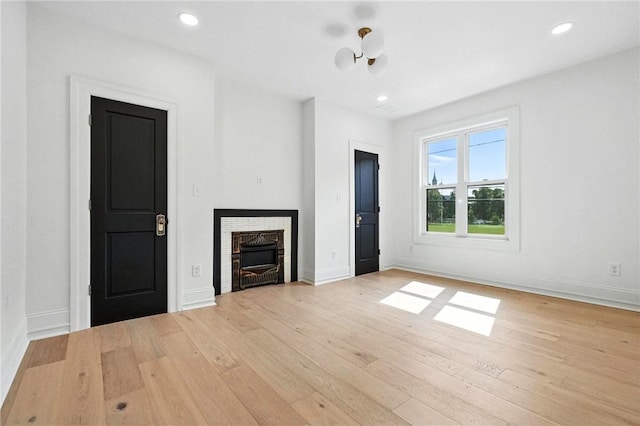 605 N Beatty, East Liberty, PA 15206 - unfurnished living room with light wood-style flooring, a fireplace, and recessed lighting