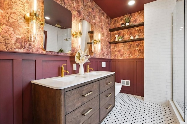 605 N Beatty, East Liberty, PA 15206 - full bathroom with wallpapered walls, a wainscoted wall, tiled shower, double vanity, and a decorative wall