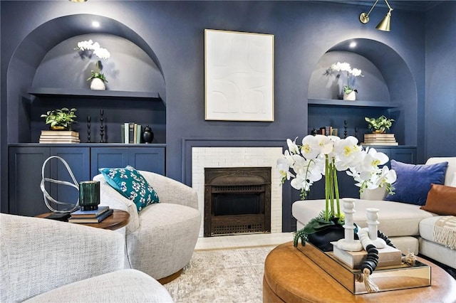 605 N Beatty, East Liberty, PA 15206 - living room featuring built in shelves, a brick fireplace, and wood finished floors