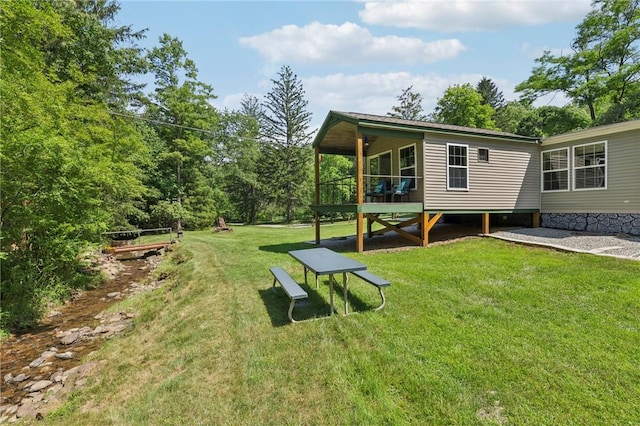 171 Fetter Ln, Ligonier Twp, PA 15658 - view of green lawn with a wooden deck