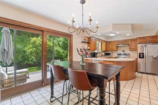 2657 Bingham Dr, Saint Clair, PA 15241 - dining room with a chandelier and light tile patterned floors