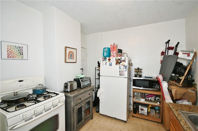300 Sherman Ave, Dravosburg, PA 15034 - kitchen featuring white appliances and dark countertops