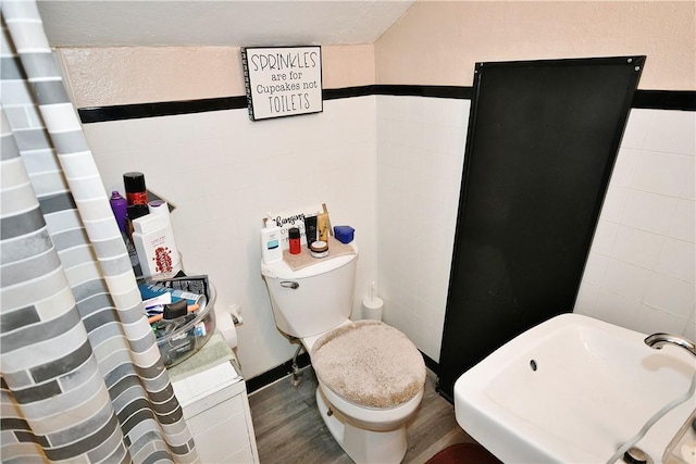 300 Sherman Ave, Dravosburg, PA 15034 - full bathroom featuring wood finished floors and tile walls