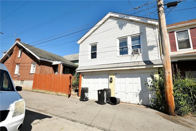 300 Sherman Ave, Dravosburg, PA 15034 - view of property exterior featuring cooling unit, driveway, and a garage