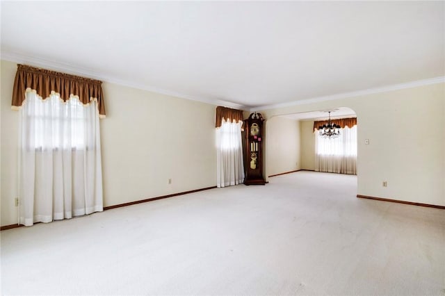 3215 Concord St, Neshannock Twp, PA 16105 - spare room with a chandelier, crown molding, light colored carpet, and arched walkways