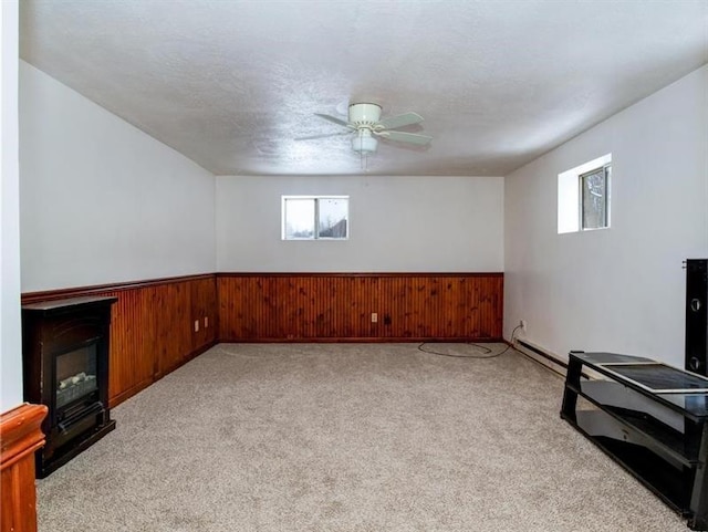 3105 Bennetts Run Rd, North Sewickley Twp, PA 15010 - basement with plenty of natural light, ceiling fan, light colored carpet, wooden walls, and wainscoting
