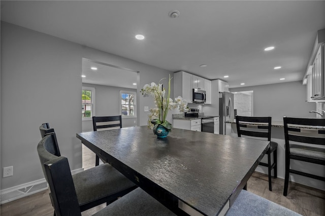 240 Wallingford Dr, Ross Twp, PA 15237 - dining space featuring wood finished floors and recessed lighting