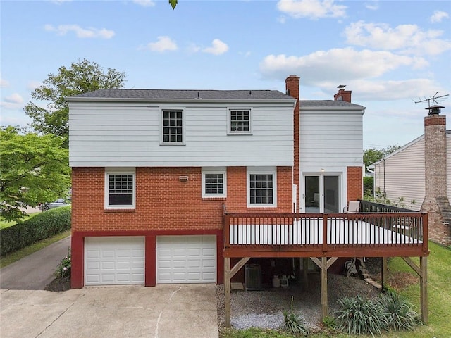 240 Wallingford Dr, Ross Twp, PA 15237 - back of house featuring driveway, an attached garage, a deck, and brick siding
