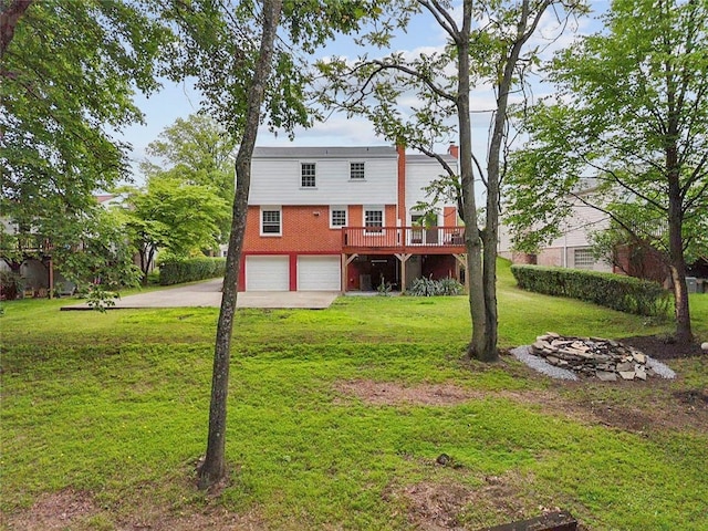 240 Wallingford Dr, Ross Twp, PA 15237 - back of house with a garage, driveway, a wooden deck, and a lawn